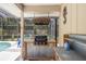 Outdoor kitchen equipped with a barrel hood, grill, corrugated metal, and wooden shelving at 505 Black Ironwood Dr, Deland, FL 32724