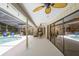 Outdoor patio beside screened-in pool, with ceiling fans, seating, and glass sliding doors to the house at 505 Black Ironwood Dr, Deland, FL 32724