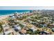 An aerial perspective of a cozy neighborhood near the ocean and commercial establishments at 505 Wisteria Rd, Daytona Beach, FL 32118