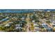 An aerial view showing a quiet street with colorful single-Gathering homes and lush mature landscaping at 505 Wisteria Rd, Daytona Beach, FL 32118