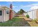 The backyard features a deck, grass, and privacy fences at 505 Wisteria Rd, Daytona Beach, FL 32118