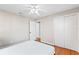 This bedroom features hardwood floors, a ceiling fan, and a closet at 505 Wisteria Rd, Daytona Beach, FL 32118