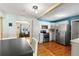 Bright kitchen with stainless appliances, white cabinets and a view to the living room at 505 Wisteria Rd, Daytona Beach, FL 32118