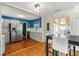 Open-concept kitchen featuring gray cabinets and stainless steel appliances at 505 Wisteria Rd, Daytona Beach, FL 32118