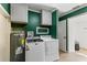 The laundry room has a washer, dryer, and water heater at 505 Wisteria Rd, Daytona Beach, FL 32118
