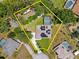 Aerial view of a property with large yard, solar panels, screened pool, boat and RV parking at 519 Donaldson Dr, Debary, FL 32713