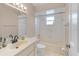 Classic bathroom with white vanity, matching toilet and bathtub, all well lit at 519 Donaldson Dr, Debary, FL 32713
