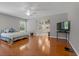 Spacious bedroom with wood floors, a ceiling fan and an en suite bathroom at 519 Donaldson Dr, Debary, FL 32713