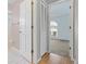 A view from the bathroom revealing an airy bedroom with an arched window at 519 Donaldson Dr, Debary, FL 32713