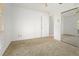 Neutral bedroom with carpet flooring and a mirrored closet in a bright and airy space at 519 Donaldson Dr, Debary, FL 32713