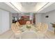 Bright dining room with modern lighting and a unique glass-top table with seating for six at 519 Donaldson Dr, Debary, FL 32713