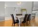 Formal dining room featuring hardwood floors, classic wainscotting, and elegant chandelier at 519 Donaldson Dr, Debary, FL 32713