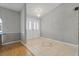Inviting entryway with decorative tile, a chandelier and glass paneled double doors at 519 Donaldson Dr, Debary, FL 32713