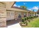 A charming entryway to a brick house, accented with neat landscaping and double doors at 519 Donaldson Dr, Debary, FL 32713