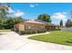 A suburban house with a two-car garage and an array of solar panels on the roof at 519 Donaldson Dr, Debary, FL 32713