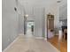Inviting home interior with tiled hallway and wood flooring leading to dining and kitchen areas at 519 Donaldson Dr, Debary, FL 32713