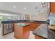 Well-lit kitchen featuring an island, stainless steel appliances, and granite countertops at 519 Donaldson Dr, Debary, FL 32713