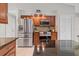 Modern kitchen with stainless steel appliances, granite countertops, and custom cabinets at 519 Donaldson Dr, Debary, FL 32713