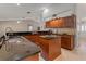 Spacious kitchen featuring granite countertops, an island, and wooden cabinetry at 519 Donaldson Dr, Debary, FL 32713