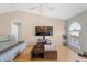 Bright living room with vaulted ceilings, recessed lights, and sleek entertainment center at 519 Donaldson Dr, Debary, FL 32713