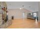 Large living room featuring brick fireplace, hardwood floors, and lots of light at 519 Donaldson Dr, Debary, FL 32713
