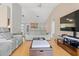 Spacious living room with vaulted ceilings, fireplace and cozy seating at 519 Donaldson Dr, Debary, FL 32713