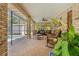 Relaxing screened patio with comfortable furniture and a view of the pool, perfect for entertaining and enjoying the outdoors at 519 Donaldson Dr, Debary, FL 32713