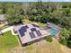 This beautiful home includes solar panels, manicured landscaping, and an inviting screened-in pool area at 519 Donaldson Dr, Debary, FL 32713