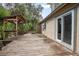 The large back deck features a gazebo and sliding glass doors to let the outside in at 5402 Turton Ln, Port Orange, FL 32127