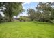 The green backyard offers seclusion and a natural, peaceful environment at 5402 Turton Ln, Port Orange, FL 32127