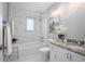 Bathroom featuring bathtub with shower, granite counter-top, vanity, and soft-close fixtures at 5402 Turton Ln, Port Orange, FL 32127
