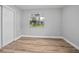 Bedroom with a window, closet, and hard wood floors at 5402 Turton Ln, Port Orange, FL 32127