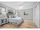 Cozy bedroom featuring a comfortable bed, ceiling fan, and two windows providing natural light at 5402 Turton Ln, Port Orange, FL 32127