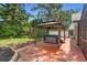 Backyard patio with hot tub and gazebo creates a private, relaxing oasis at 552 Hamlet Dr, Port Orange, FL 32127
