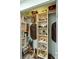 Well-organized closet with custom shelves, providing ample storage for clothes and accessories at 552 Hamlet Dr, Port Orange, FL 32127