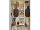 Organized closet with built-in shelves and hanging space for clothing storage at 552 Hamlet Dr, Port Orange, FL 32127