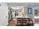 Bright kitchen with stainless steel appliances, a breakfast bar with seating, and access to the pool area at 552 Hamlet Dr, Port Orange, FL 32127