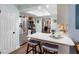 A bright kitchen with stainless steel appliances, white cabinets, and a skylight at 552 Hamlet Dr, Port Orange, FL 32127