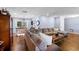 Open-concept living room with wood floors, blending comfort and style for modern living and entertaining at 552 Hamlet Dr, Port Orange, FL 32127