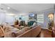 Comfortable living room showcasing stylish decor, including a sectional sofa and wood floors for a cozy atmosphere at 552 Hamlet Dr, Port Orange, FL 32127