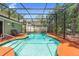 Private screened-in pool area with deck, perfect for outdoor relaxation and entertaining in a serene setting at 552 Hamlet Dr, Port Orange, FL 32127