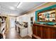 Versatile bonus room featuring built-in cabinets, shelving, and ample desk space at 552 Hamlet Dr, Port Orange, FL 32127