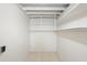 This white basement features tiled floors and wood beam ceilings at 5825 Forest Grove Blvd, Orlando, FL 32808
