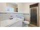 This bathroom features tile accents, a shower stall, a toilet, a mirror, and a sink at 5825 Forest Grove Blvd, Orlando, FL 32808