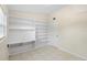This tiled floor bedroom features built-in shelving and natural light at 5825 Forest Grove Blvd, Orlando, FL 32808
