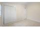 A clean, bright bedroom features a closet and tiled floor, bathed in natural light at 5825 Forest Grove Blvd, Orlando, FL 32808