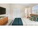 Cozy bedroom with ample closet space, a comfortable bed, and a window at 5825 Forest Grove Blvd, Orlando, FL 32808