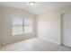 This tiled floor bedroom features natural light and a door at 5825 Forest Grove Blvd, Orlando, FL 32808