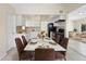 Bright dining area featuring a modern marble table and stylish brown chairs at 5825 Forest Grove Blvd, Orlando, FL 32808