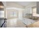 Open kitchen with stainless steel sink, granite countertops, and white cabinets offers ample space at 5825 Forest Grove Blvd, Orlando, FL 32808